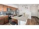 Well-equipped kitchen featuring a large island, modern appliances, and stylish backsplash at 14106 Red Cosmos St, Parker, CO 80134