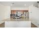 This kitchen features granite countertops, stainless steel appliances, and wood cabinets at 14106 Red Cosmos St, Parker, CO 80134