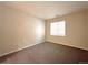 Neutral bedroom with carpet flooring and ample natural light from window at 8338 S Independence Cir # 104, Littleton, CO 80128