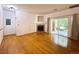 Bright living room with hardwood floors, fireplace, and sliding door access to the outside at 8338 S Independence Cir # 104, Littleton, CO 80128