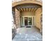 Covered patio with stone accents and sliding glass doors at 8338 S Independence Cir # 104, Littleton, CO 80128