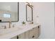 Dual sink vanity and modern finishes in a bathroom with great lighting at 2530 Chase, Edgewater, CO 80215