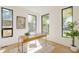 Bright office space with modern windows and a stylish desk at 2530 Chase, Edgewater, CO 80215