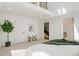 Bright bedroom features an open design and ensuite bathroom at 2530 Chase, Edgewater, CO 80215
