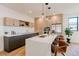 Spacious kitchen featuring an oversized island with a sink, and stainless steel appliances at 2530 Chase, Edgewater, CO 80215
