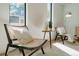 Cozy living room corner with natural light, stylish chairs, and hardwood floors at 2530 Chase, Edgewater, CO 80215