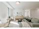 Spacious living room with a comfortable sofa, hardwood floors, and modern decor at 2530 Chase, Edgewater, CO 80215