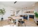 Open floor plan that combines dining area and kitchen with sleek design features at 2530 Chase, Edgewater, CO 80215