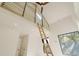 A view showcasing a room with a ladder leading to an overhead loft at 2530 Chase, Edgewater, CO 80215