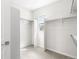 Spacious walk-in closet with ample shelving, providing optimal organization and storage solutions at 8893 Springsong Ln, Littleton, CO 80125