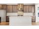 A modern kitchen showcases stylish cabinetry, an island, and stainless steel appliances at 8893 Springsong Ln, Littleton, CO 80125