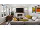 Living room showcasing a fireplace, modern furniture, and abundant natural light at 8893 Springsong Ln, Littleton, CO 80125