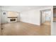 Spacious open concept living room featuring a fireplace and hardwood floors at 8893 Springsong Ln, Littleton, CO 80125
