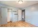 Bedroom with hardwood floors featuring closet and entrance to another room at 1785 S Zuni St, Denver, CO 80223