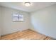 Bedroom with hardwood floors and natural light coming from the window at 1785 S Zuni St, Denver, CO 80223