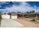 Charming brick home with a well-manicured lawn, front garden, and a detached garage at 1785 S Zuni St, Denver, CO 80223