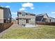 Residential backyard featuring a patio, lush lawn, and privacy fence at 24784 E Tennessee Pl, Aurora, CO 80018