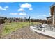 Beautiful backyard featuring a stone patio and a well-manicured lawn, perfect for outdoor activities at 24784 E Tennessee Pl, Aurora, CO 80018