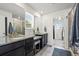 Bathroom features granite countertops, dual sinks, a walk-in shower, and a separate vanity area at 24784 E Tennessee Pl, Aurora, CO 80018