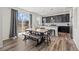 Bright dining area features a wooden table, bench, and sliding glass door with backyard views at 24784 E Tennessee Pl, Aurora, CO 80018