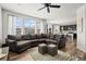 Open-concept living room flows into a modern kitchen, offering seamless entertaining space at 24784 E Tennessee Pl, Aurora, CO 80018