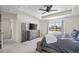 Comfortable main bedroom with a dresser, TV and windows offering ample light at 24784 E Tennessee Pl, Aurora, CO 80018