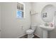 Cozy powder room featuring classic fixtures, and a pedestal sink at 24784 E Tennessee Pl, Aurora, CO 80018