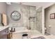 Spa-like bathroom featuring a soaking tub and a glass-enclosed shower with stylish tile work at 2700 W Greens Pl, Littleton, CO 80123