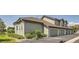 View of a well maintained apartment building showcasing modern architecture and a neatly paved parking area at 2700 W Greens Pl, Littleton, CO 80123