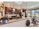 Contemporary kitchen with stainless steel appliances, and granite countertops, perfect for culinary enthusiasts and entertaining at 2700 W Greens Pl, Littleton, CO 80123