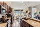 Modern kitchen featuring stainless steel appliances, granite countertops, and wood cabinets, perfect for cooking at 2700 W Greens Pl, Littleton, CO 80123