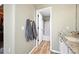 An elegant bathroom with an open door leading to a shower and towels on the wall at 3928 Miners Candle Dr, Castle Rock, CO 80109