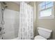 A gorgeous bathroom with a shower/tub combo, toilet, and a window for natural light at 3928 Miners Candle Dr, Castle Rock, CO 80109