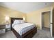 Bedroom featuring a dark wood bed frame, neutral walls, and a doorway at 3928 Miners Candle Dr, Castle Rock, CO 80109