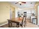 Bright kitchen and dining area combination featuring updated appliances and modern fixtures at 3928 Miners Candle Dr, Castle Rock, CO 80109