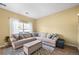 Comfortable living room with neutral tones, an area rug, and lots of space for seating at 3928 Miners Candle Dr, Castle Rock, CO 80109
