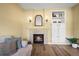 Charming living room features a fireplace, a built-in cabinet, and a decorative mirror at 3928 Miners Candle Dr, Castle Rock, CO 80109
