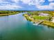 Community lake featuring a pier and recreation area with lush trees at 12846 Palisade St, Mead, CO 80504