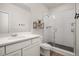 Clean bathroom with a single sink vanity, and a glass enclosed shower with subway tile at 12846 Palisade St, Mead, CO 80504