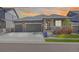 Charming single-story home with a well-manicured lawn, three-car garage, and a welcoming front porch at 12846 Palisade St, Mead, CO 80504
