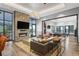 Contemporary lounge area with a stone fireplace, modern furnishings and decor at 12846 Palisade St, Mead, CO 80504