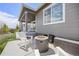 Relaxing patio with a fire pit and comfortable seating with beautiful backyard views at 12846 Palisade St, Mead, CO 80504