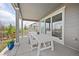 Covered patio featuring an outdoor dining table and chairs for entertaining at 12846 Palisade St, Mead, CO 80504