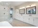 Luxurious bathroom features double vanity, soaking tub, glass shower, and modern fixtures at 8015 Parnassus Pl, Castle Rock, CO 80108