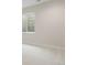 The unfinished basement bedroom features a painted floor and an egress window at 8015 Parnassus Pl, Castle Rock, CO 80108