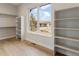 Spacious walk-in closet with built-in shelving for organized storage and a window with a view at 8015 Parnassus Pl, Castle Rock, CO 80108