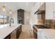 Stylish kitchen features a modern island, professional-grade appliances, and open access to living area at 8015 Parnassus Pl, Castle Rock, CO 80108