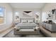 Serene bedroom with neutral tones, decorative wall art, and an abundance of natural light at 8015 Parnassus Pl, Castle Rock, CO 80108