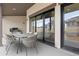 Outdoor patio area featuring stylish dining set and a grill, perfect for entertaining at 8015 Parnassus Pl, Castle Rock, CO 80108