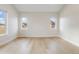 Versatile room with hardwood floors, abundant light, and views of the surrounding neighborhood at 8015 Parnassus Pl, Castle Rock, CO 80108
